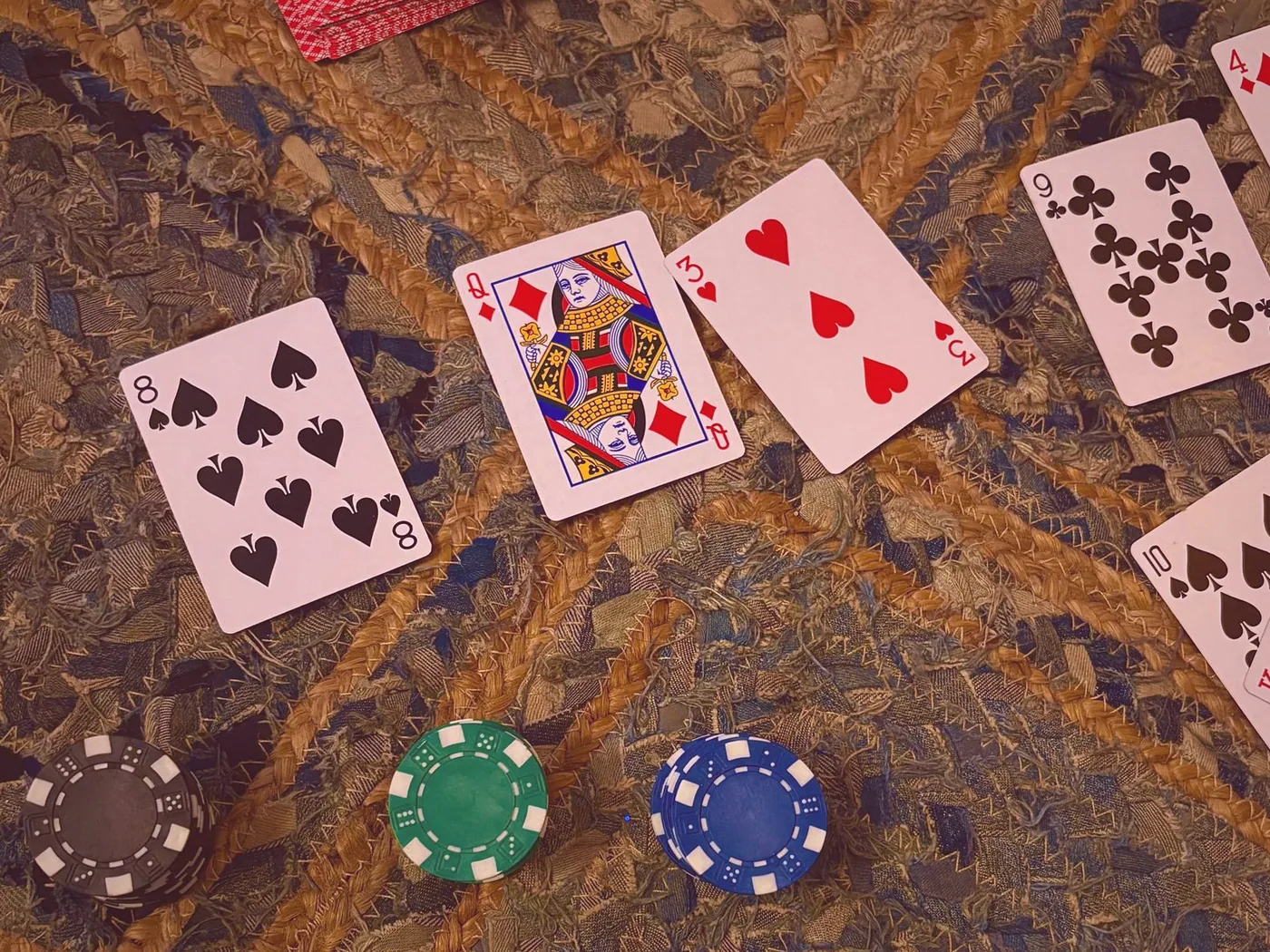 Cards fanned out on green felt