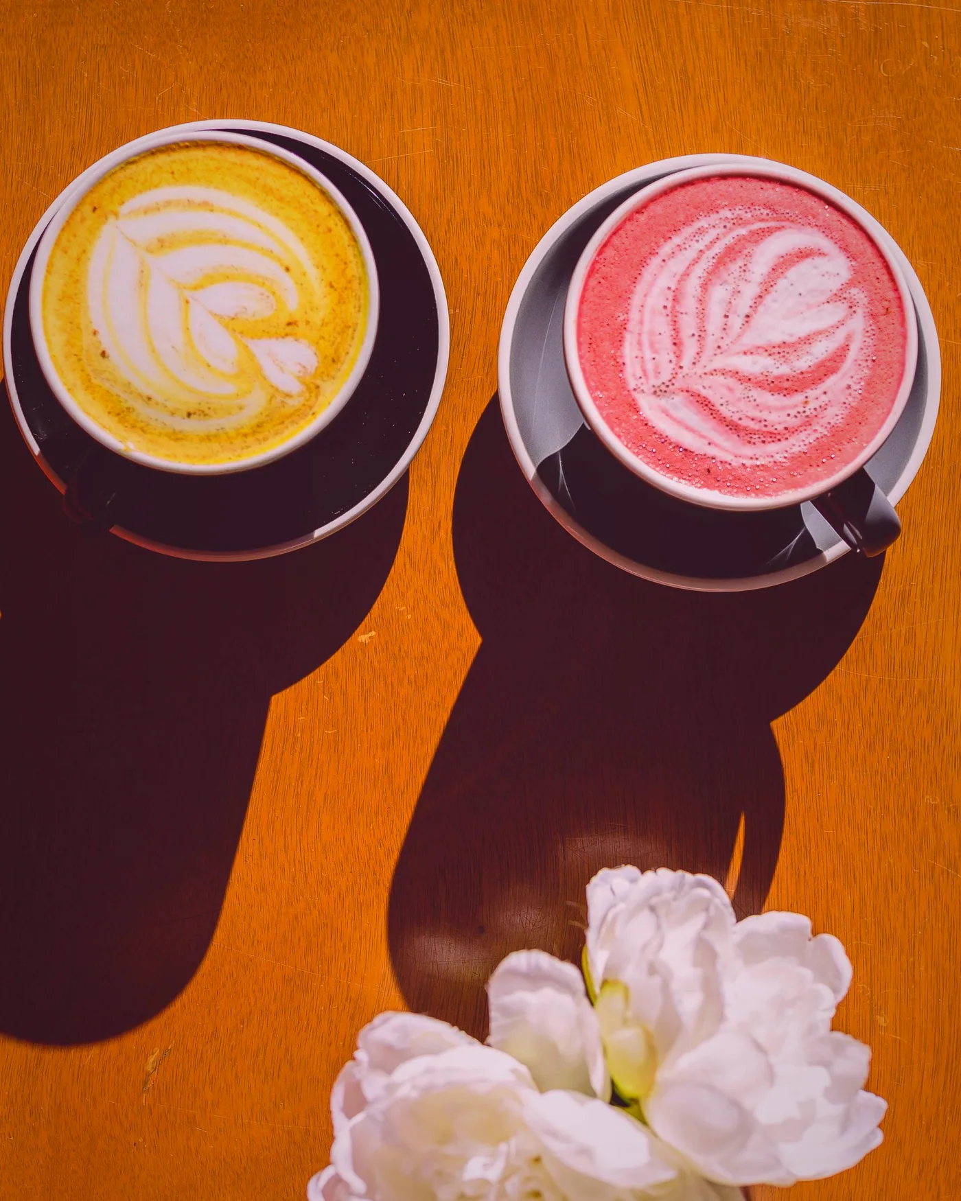 Two coffees carried through from the counter